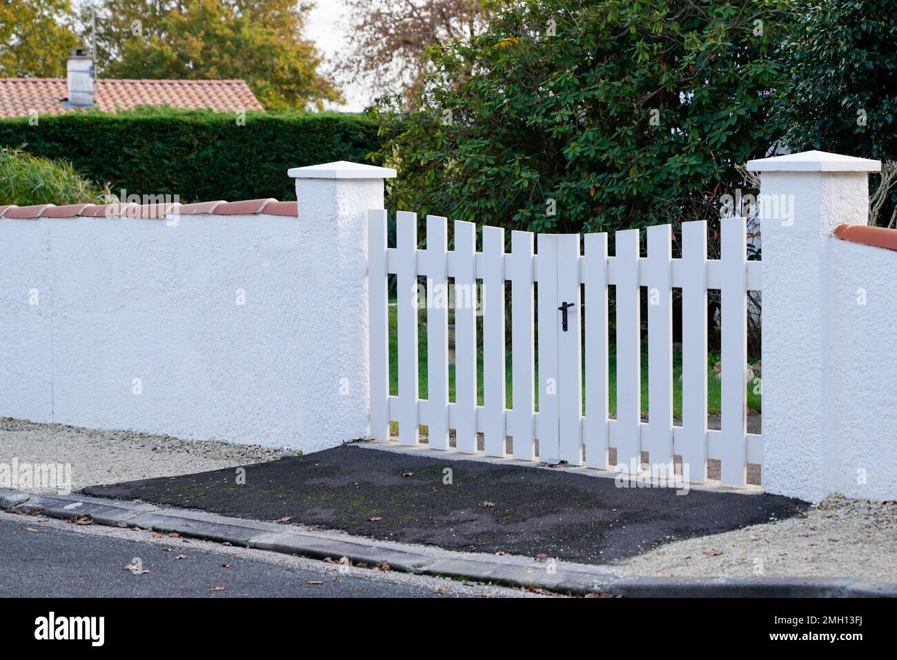 portal white PVC gate garden door and family home access house Stock Photo