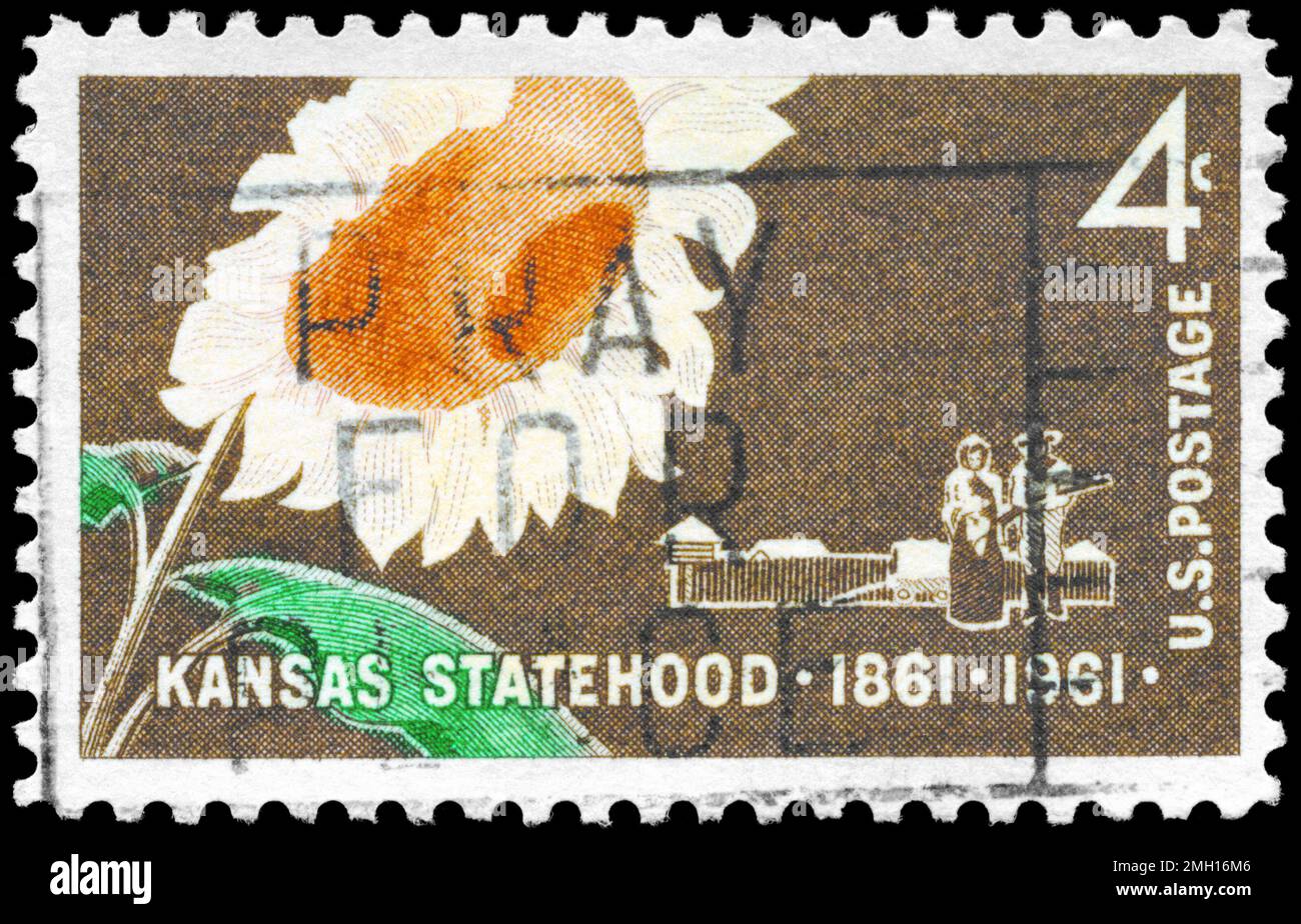 USA - CIRCA 1961: A Stamp printed in USA shows the Sunflower, Pioneer couple and Stockade, Kansas Statehood Centenary, circa 1961 Stock Photo