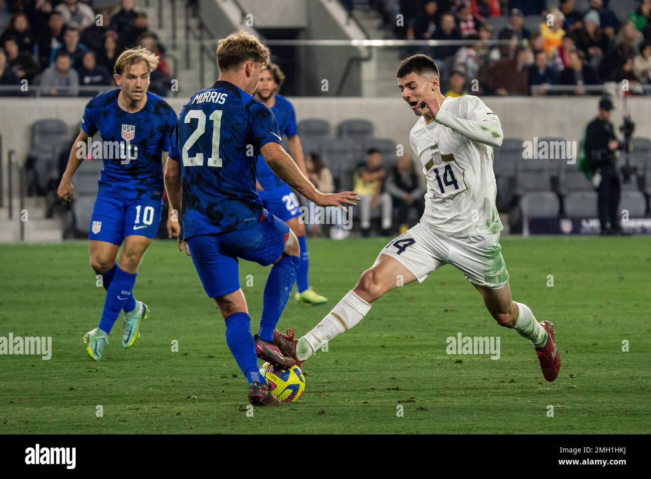 United States of America midfielder Aldan Morris (21) and Serbia midfielder Nikola Petković (14) battle for possession during an international friendl Stock Photo