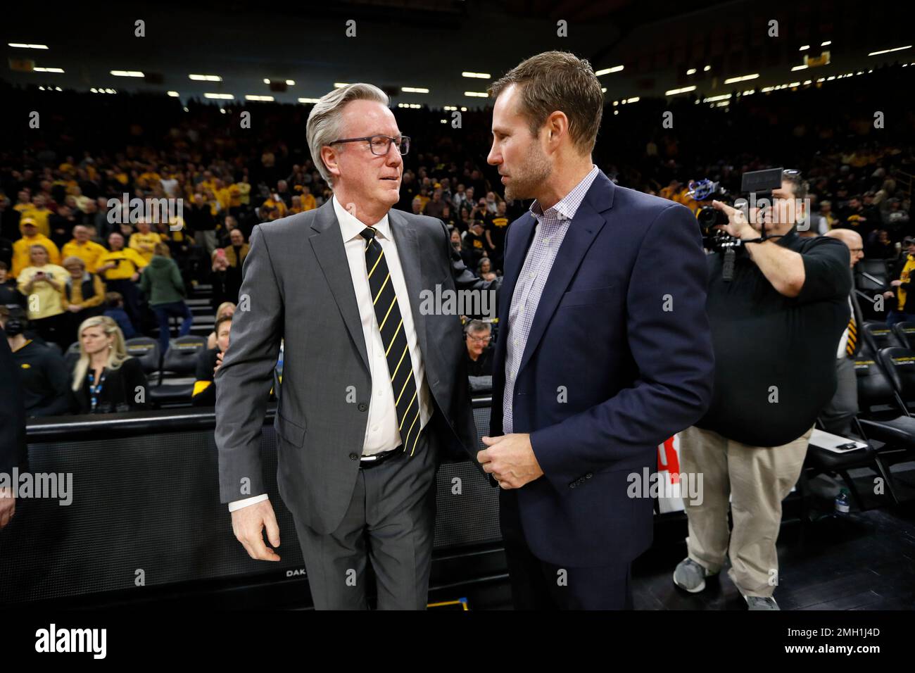 Iowa head coach Fran McCaffery, left, greets Nebraska head coach Fred
