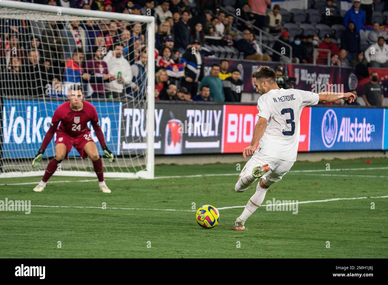 Serbia defender Nemanja Petrović (3) sends a pass in the box as United States of America goalkeeper Gaga Slonina (24) defends during an international Stock Photo