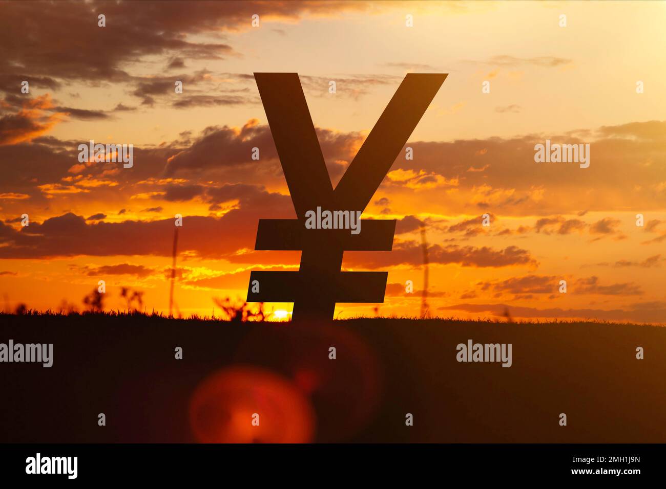 Yen currency at sunset in the rays of the setting sun. Sunset currency. Devaluation of money.. Stock Photo