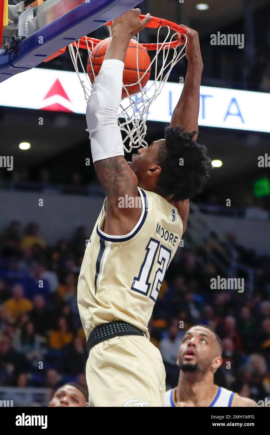 Pittsburgh's Abdoul Karim Coulibaly (12) dunks over Pittsburgh's ...