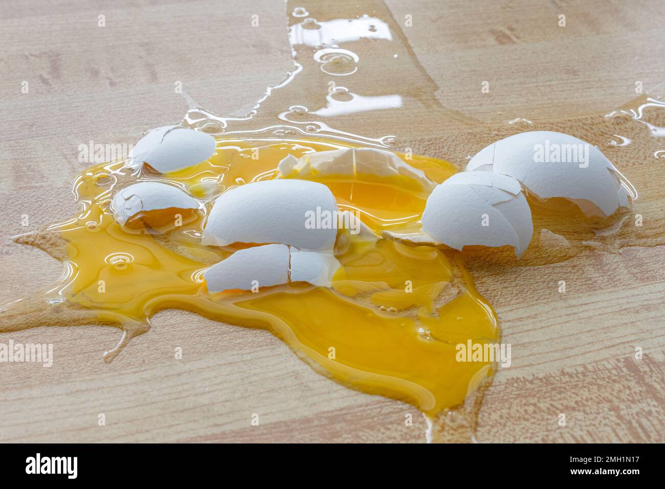 Horizontal shot of a shattered chicken egg on the floor Stock Photo Alamy