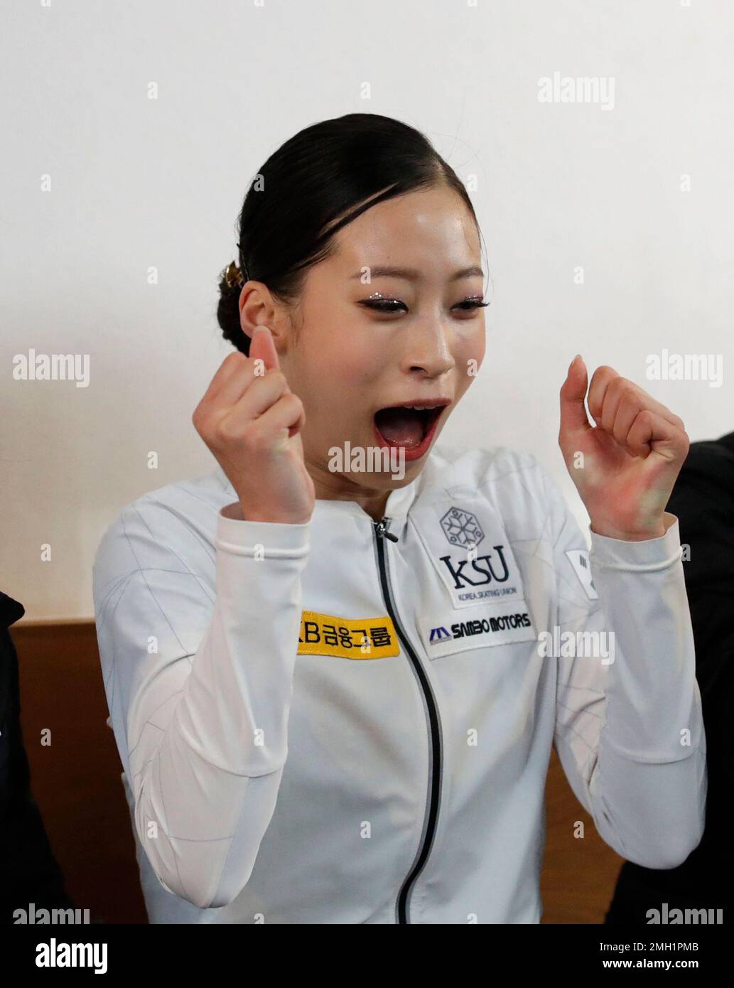 South Korea's You Young reacts to scoring after the ladies' single free