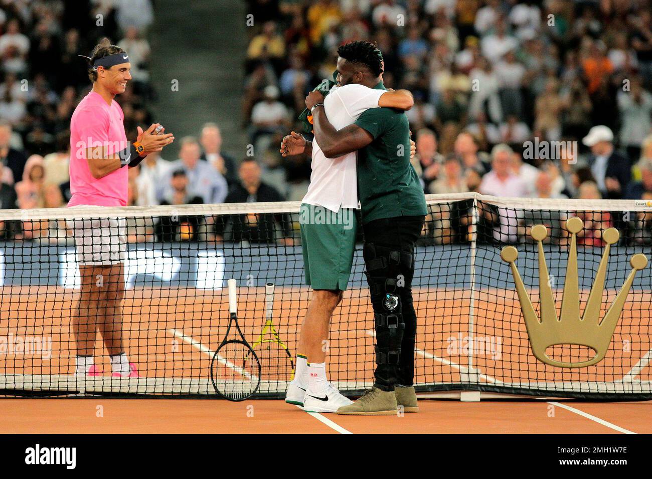 Springbok Captain Siya Kolisi, right, greets Roger Federer while Rafael  Nadal looks on ahead of their exhibition tennis match held at the Cape Town  Stadium in Cape Town, South Africa, Friday Feb.