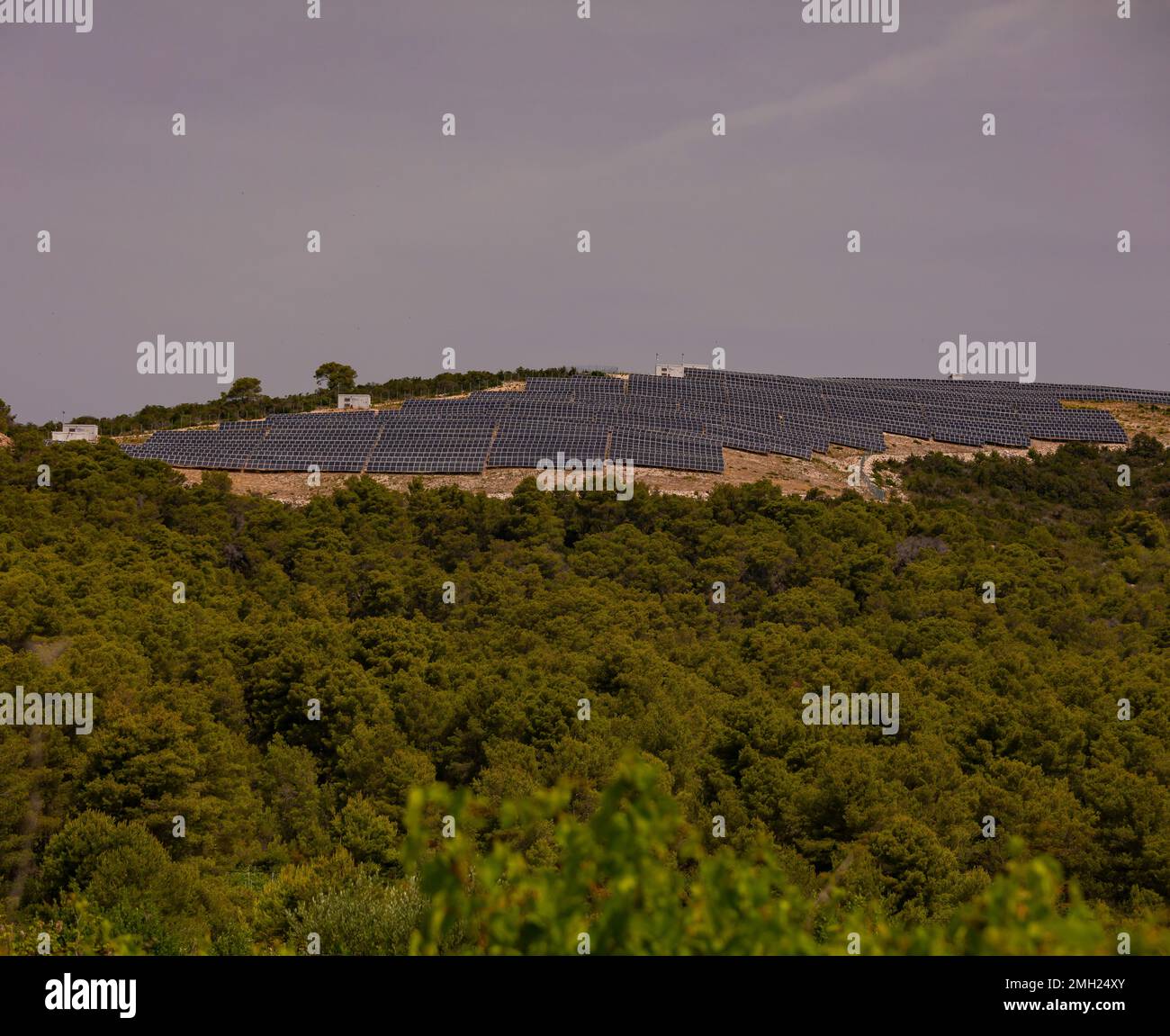 VIS, CROATIA, EUROPE - Solar panels on hilltops in the interior of the island of Vis. Stock Photo