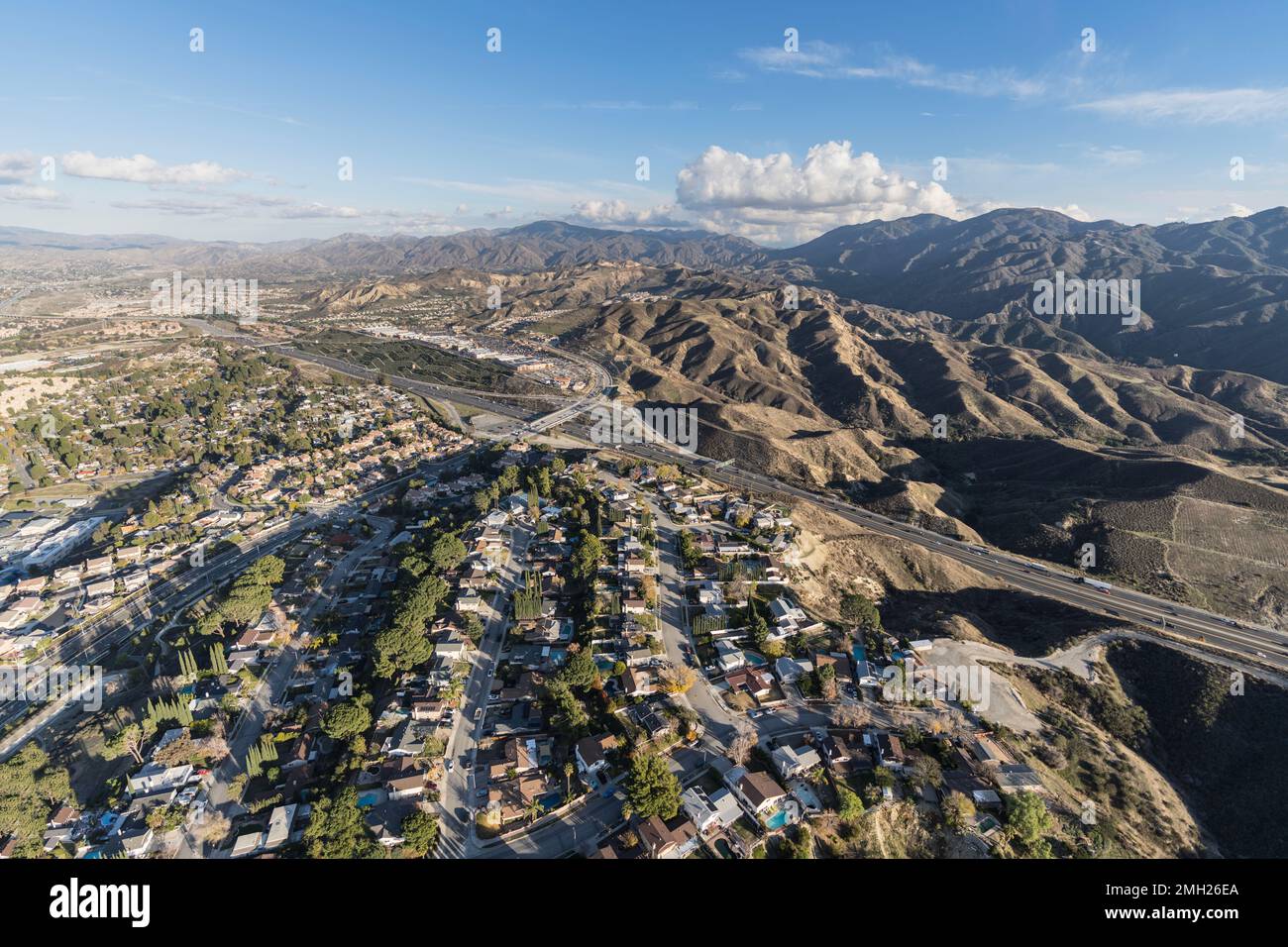 Aerial cityscape view of suburban sprawl in the Santa Clarita community of Los Angeles County, California. Stock Photo