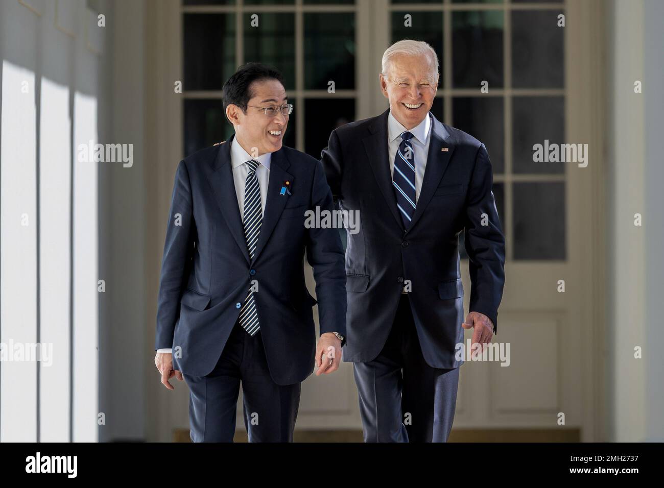 President Joe Biden walks along the West Colonnade with Japanese Prime Minister Fumio Kishida, Friday, January 13, 2023, at the White House. (Official White House Photo by Cameron Smith) Stock Photo