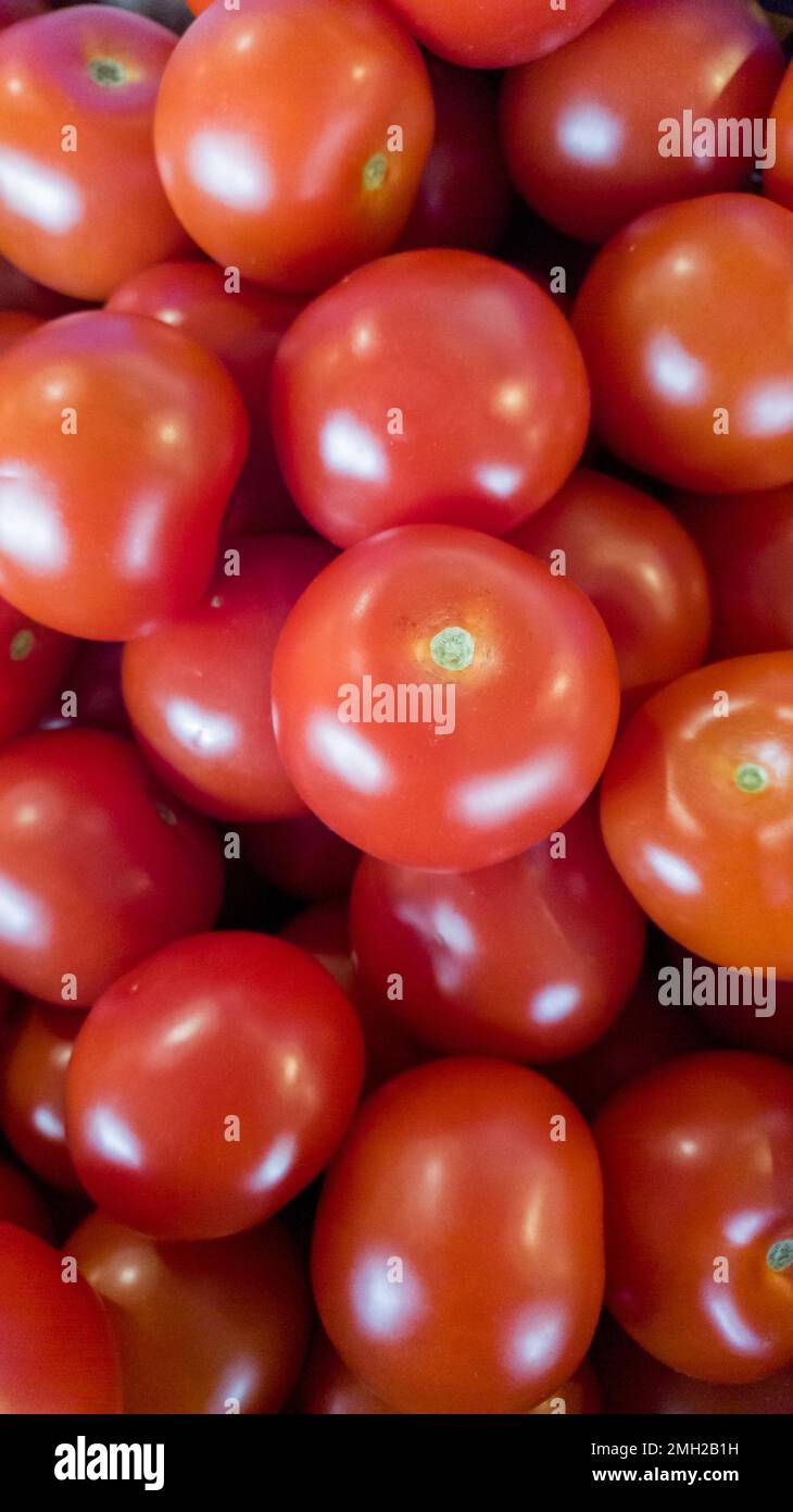 Bunch of small tomatoes in top down view Stock Photo - Alamy
