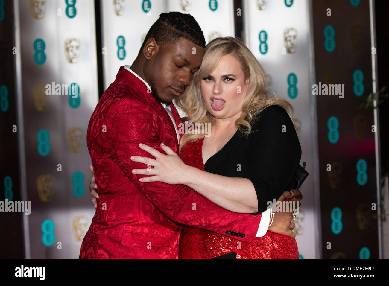 John Boyega and Rebel Wilson pose for photographers upon arrival at the ...