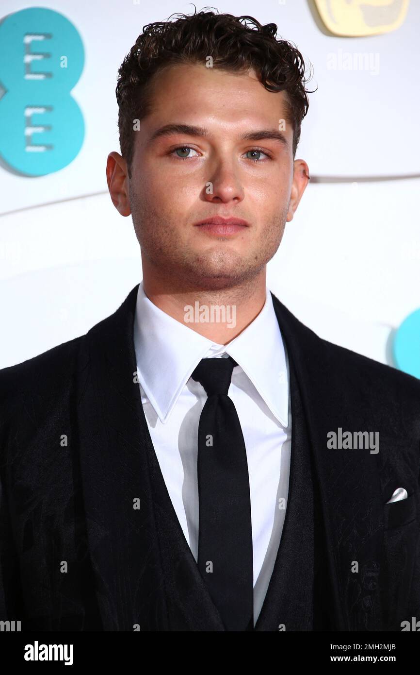 Rafferty Law poses for photographers upon arrival at the Bafta Film Awards, in central London