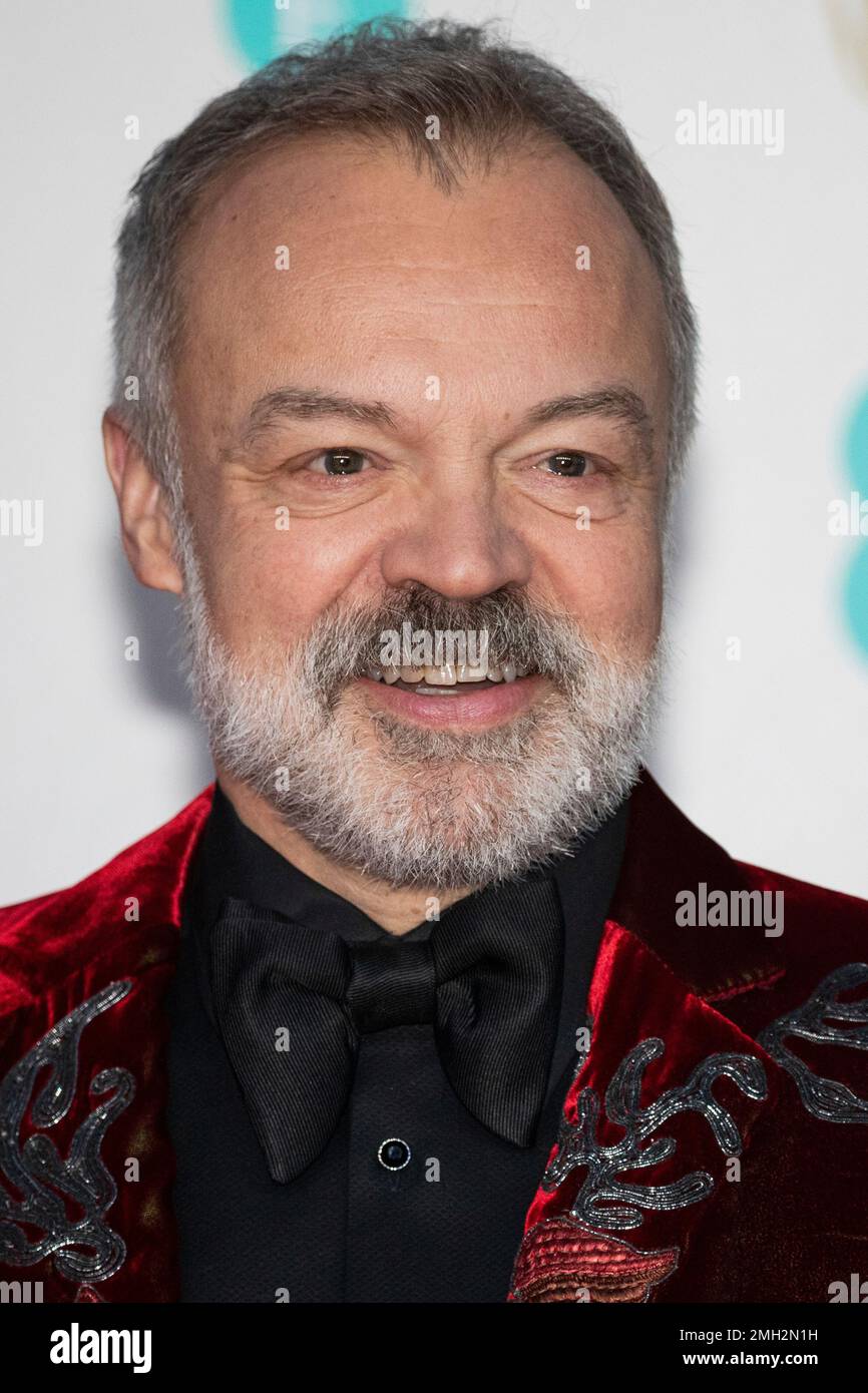 Graham Norton poses for photographers upon arrival at the Bafta Film