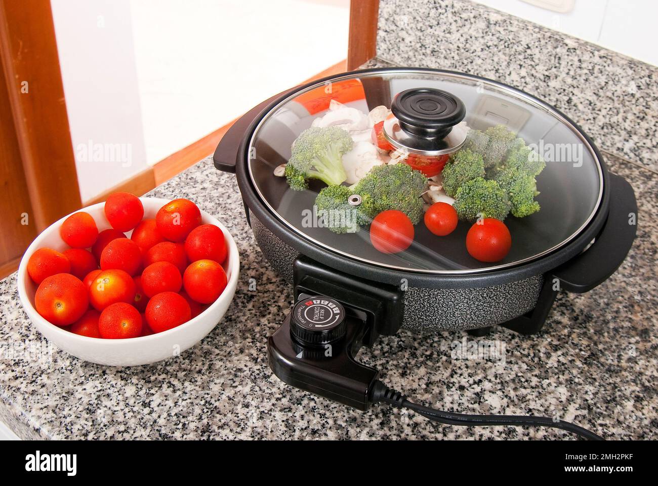 The Multiple Purpose Of Electric Pan For Your Food Cooking Stock Photo,  Picture and Royalty Free Image. Image 17584539.