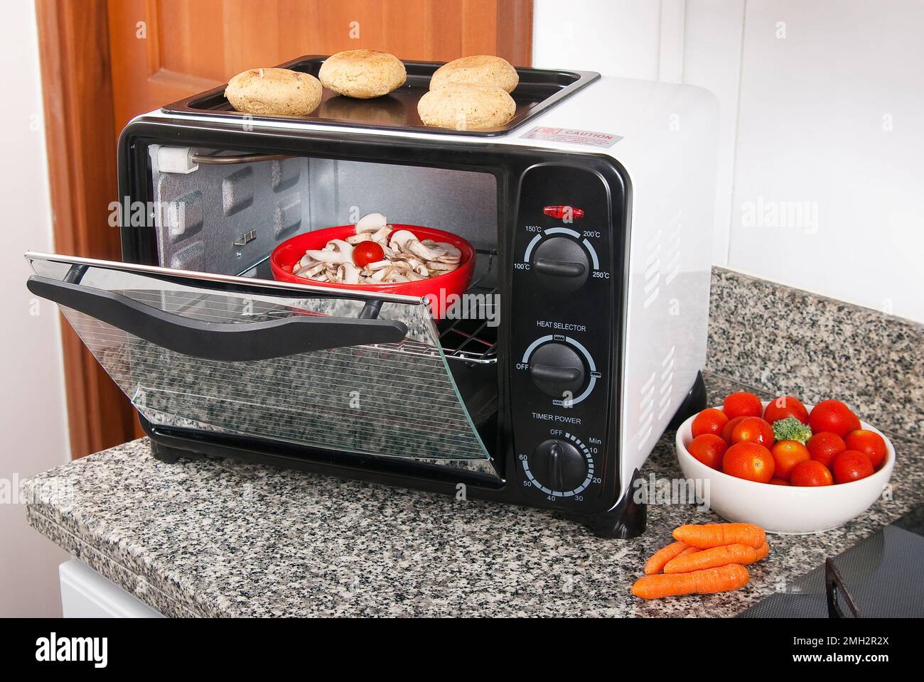Household appliance; toaster oven, photo in kitchen environment Stock