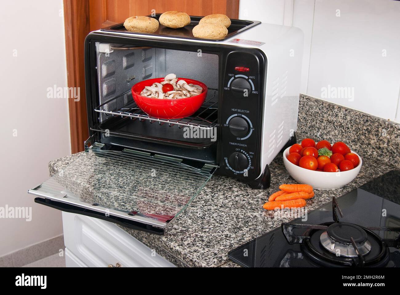 Household appliance; toaster oven, photo in kitchen environment Stock