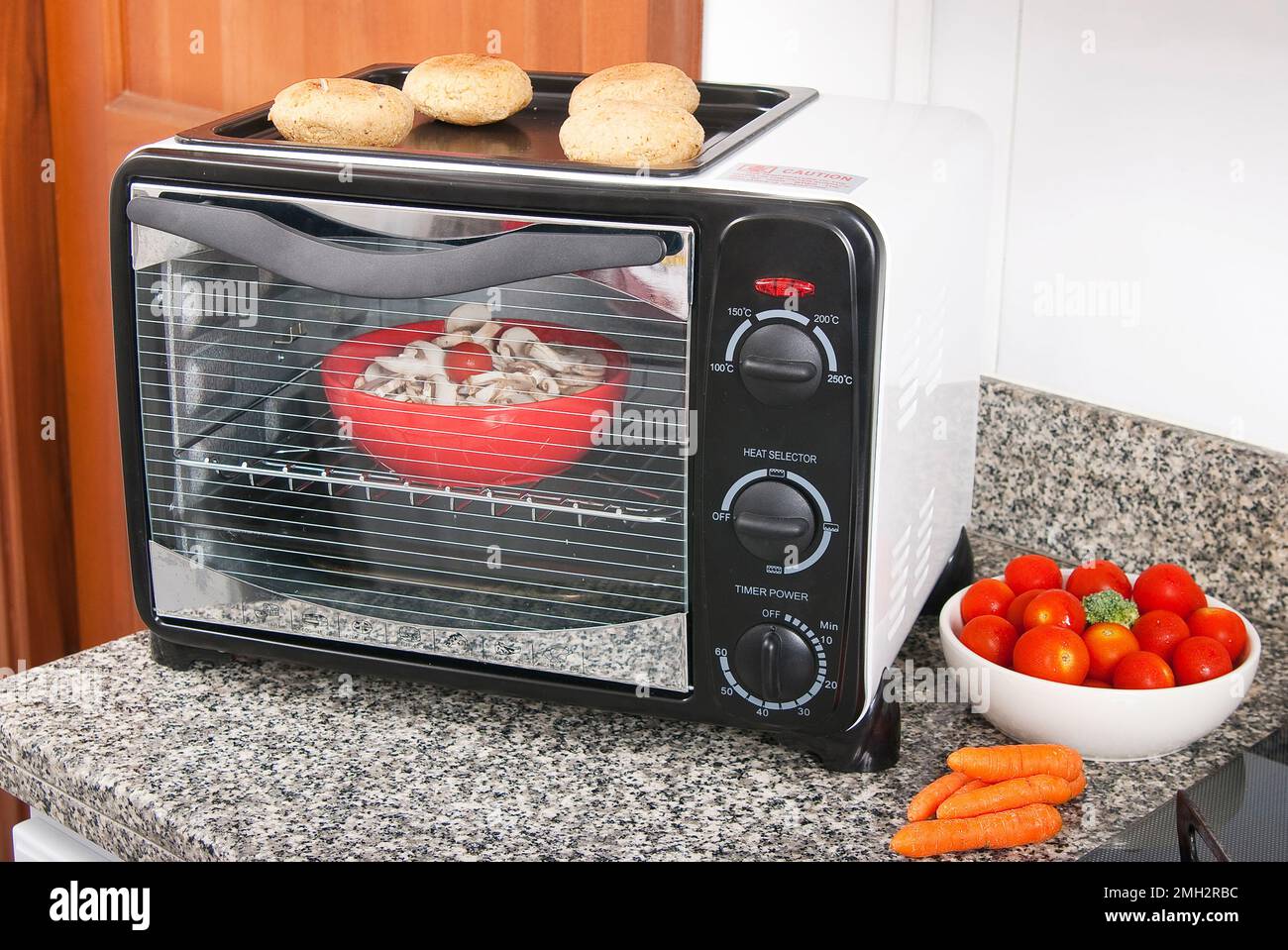 Household appliance; toaster oven, photo in kitchen environment. Stock Photo