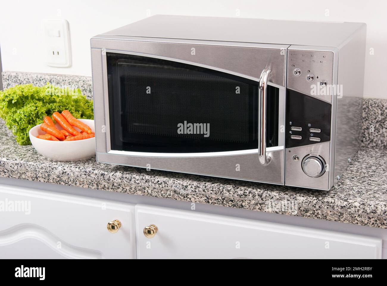 Microwave oven; photo in kitchen environment Stock Photo - Alamy