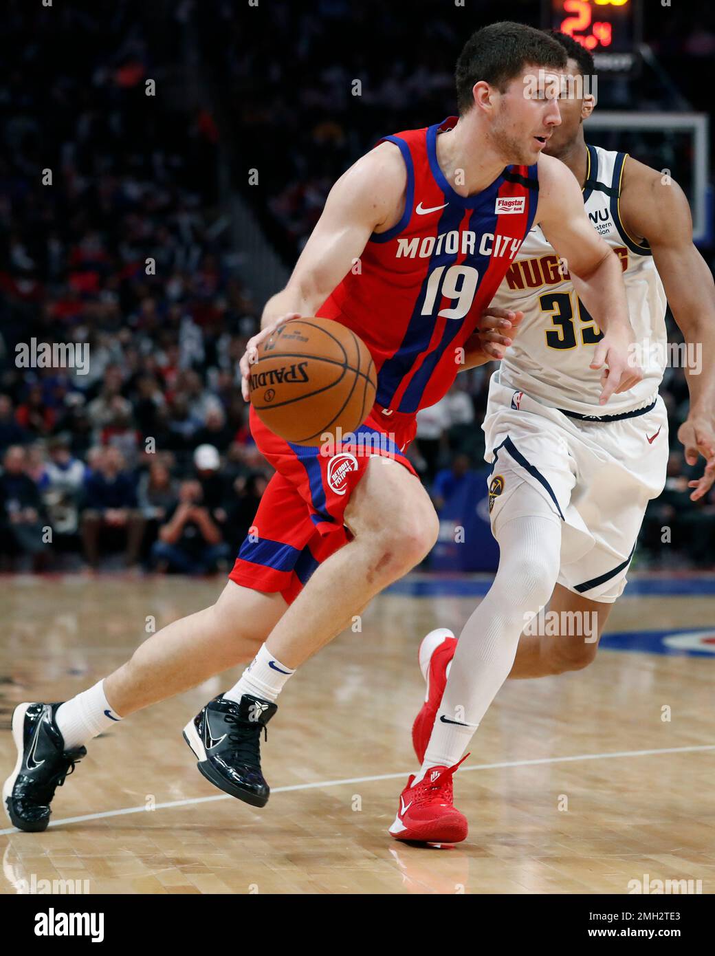 Detroit Pistons guard Sviatoslav Mykhailiuk (19) drives on Denver