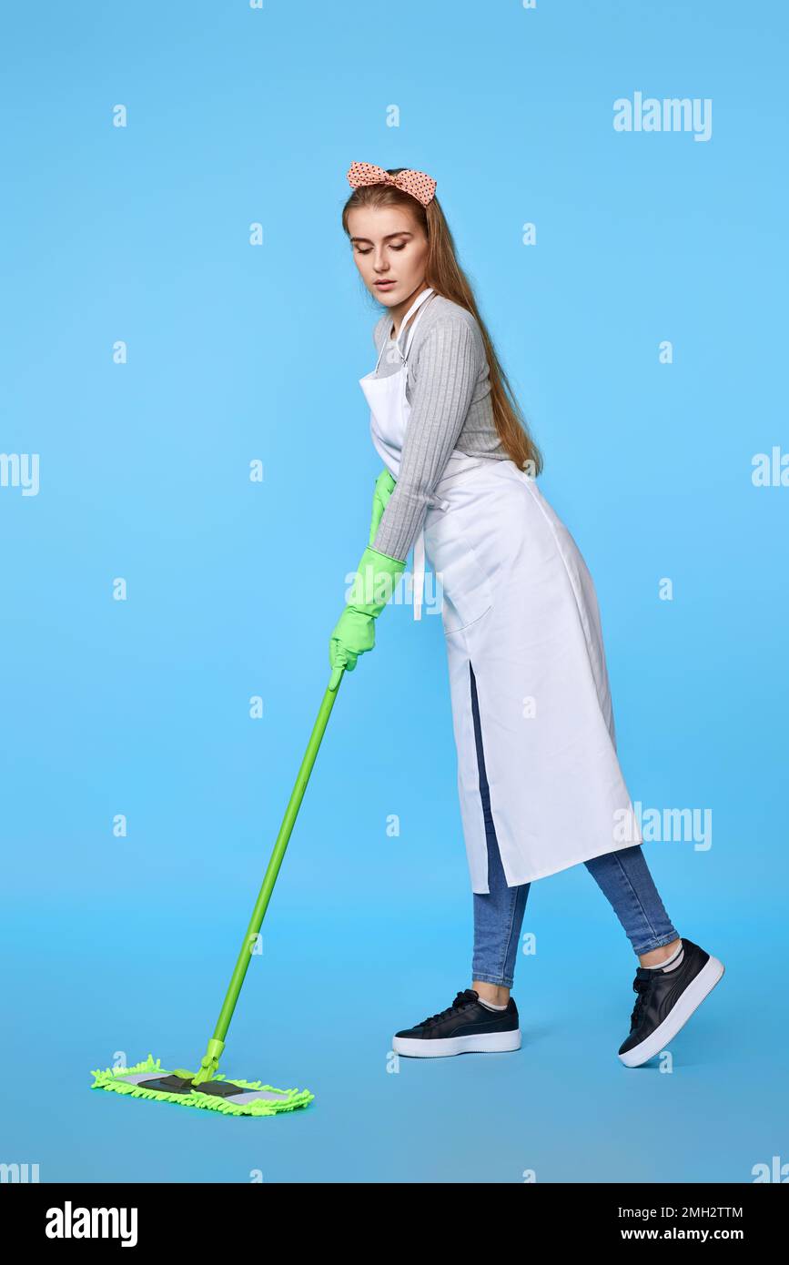 woman in rubber gloves and cleaner apron washing floor with mop Stock ...