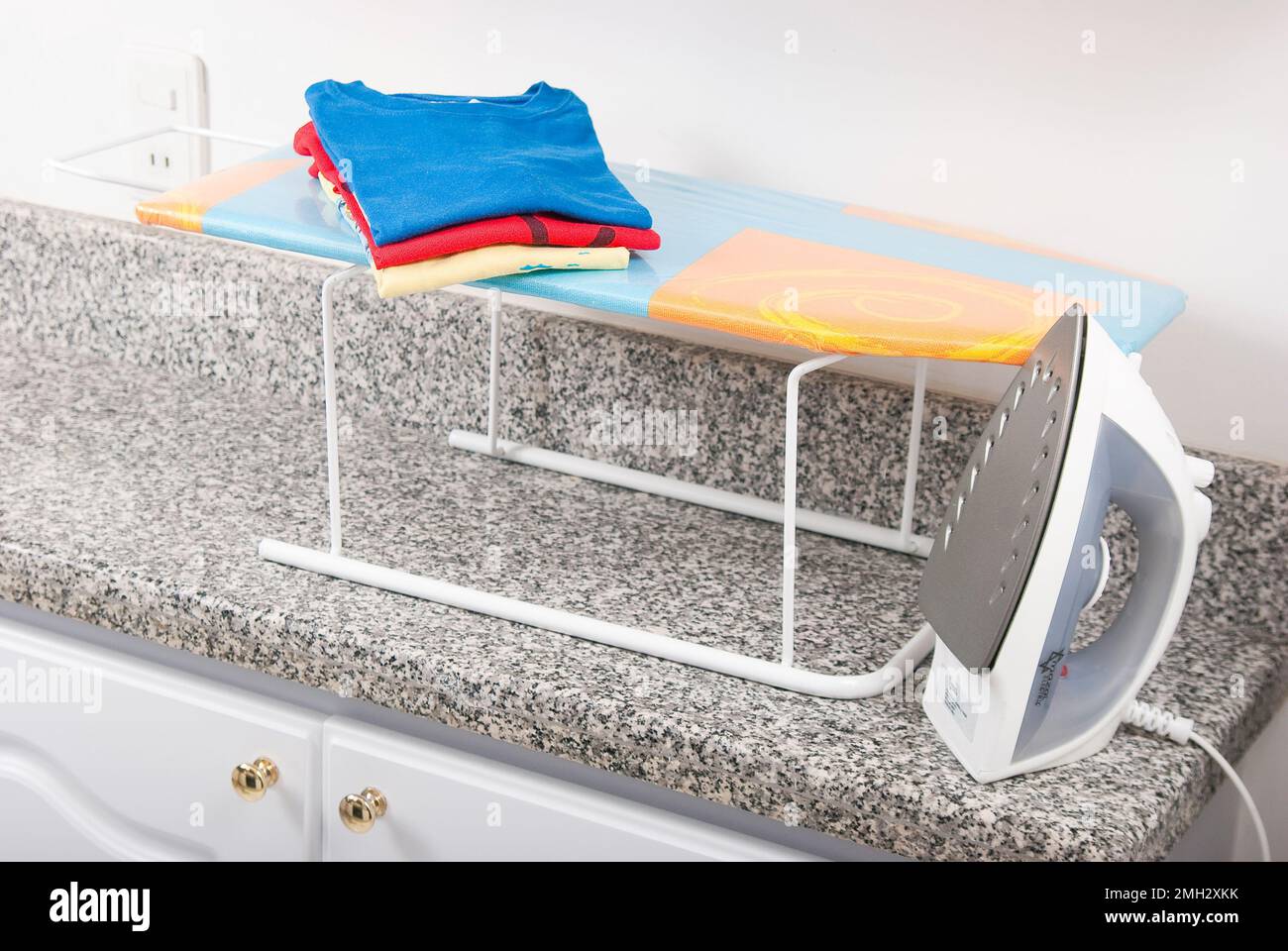 Ironing board and iron for clothes Stock Photo Alamy