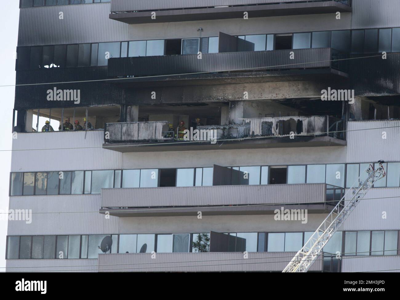 Firefighters respond to a fire at a residential building in Los Angeles ...