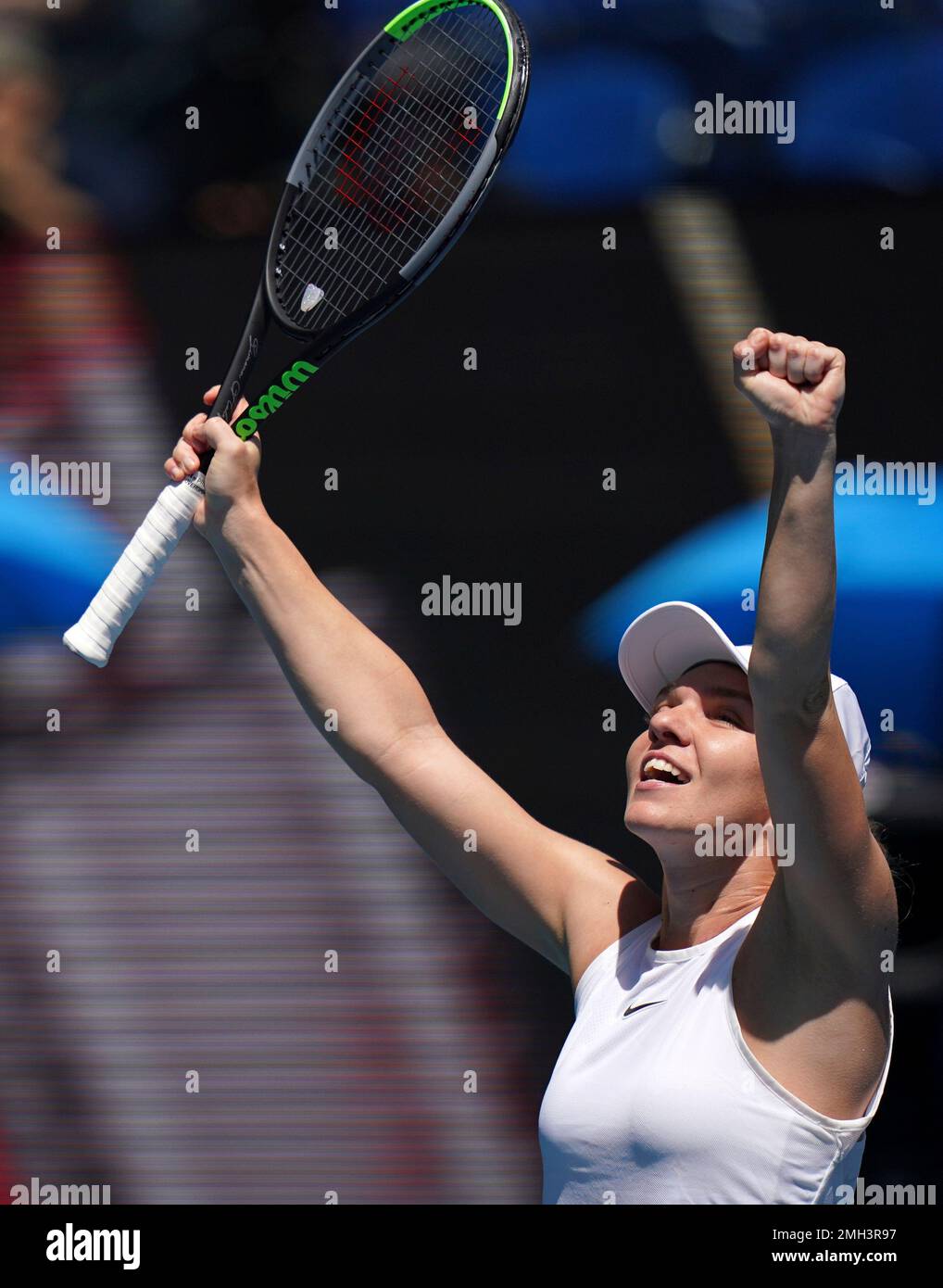 Romanias Simona Halep celebrates after defeating Estonias Anett Kontaveit during their quarterfinal match at the Australian Open tennis championship in Melbourne, Australia, Wednesday, Jan