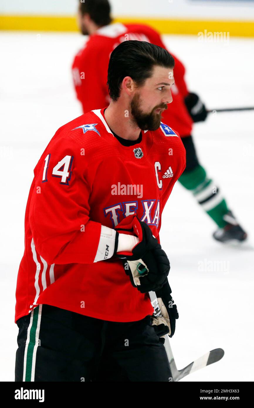 Dallas Stars left wing Jamie Benn wears a baseball style jersey during warm ups on Texas Rangers Night prior to an NHL hockey game against the Tampa Bay Lightning in Dallas Monday Jan