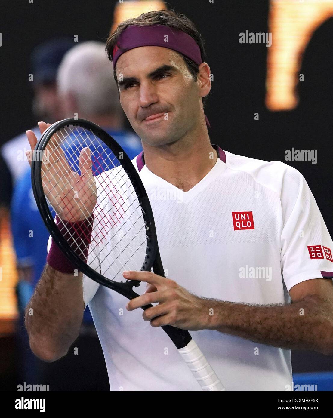 Switzerland's Roger Federer reacts after defeating Tennys Sandgren of the  U.S. in their quarterfinal match at the Australian Open tennis championship  in Melbourne, Australia, Tuesday, Jan. 28, 2020. (AP Photo/Lee Jin-man Stock