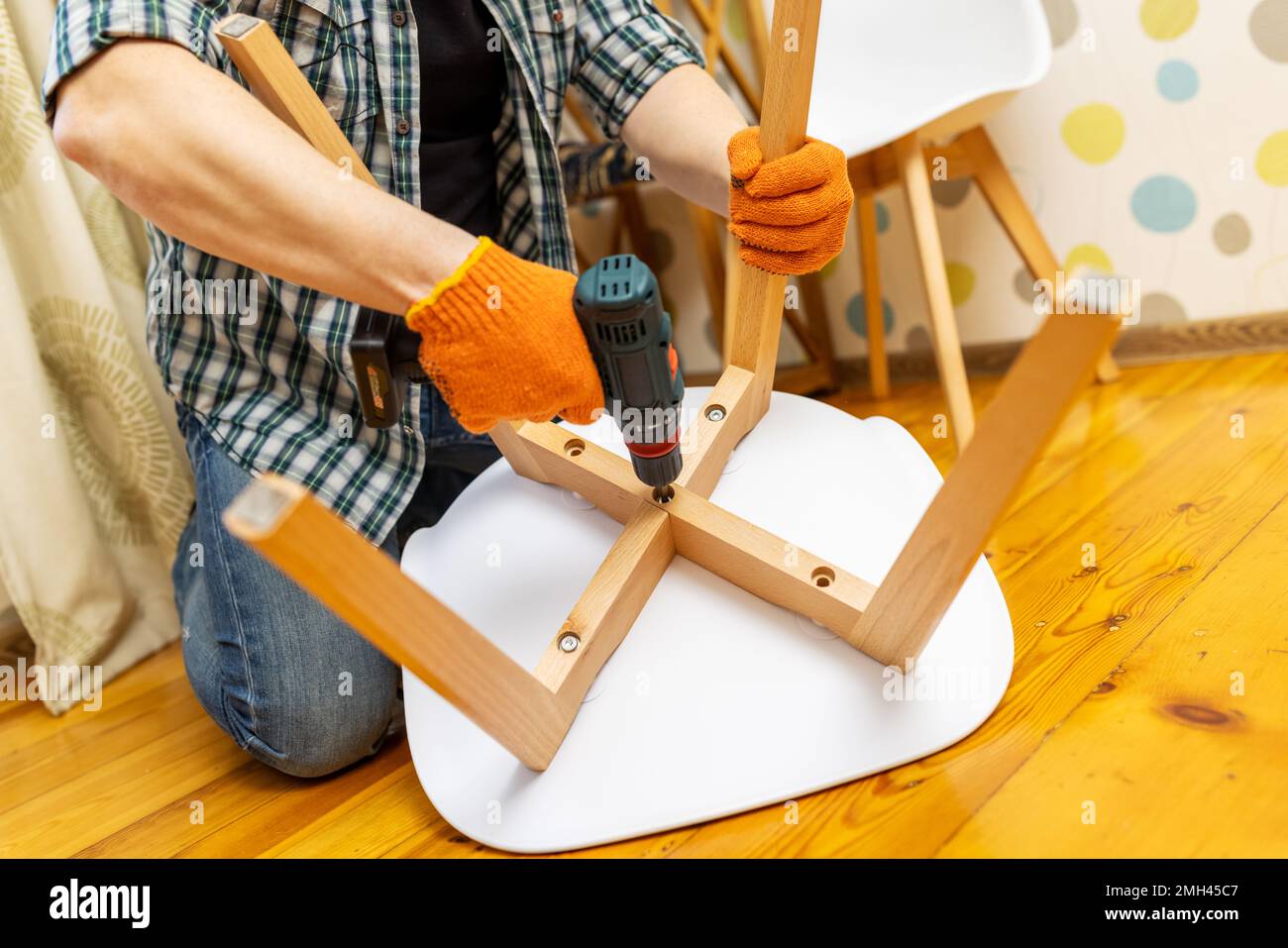 Assemble furniture. Man assembling chair. Furniture assembler with