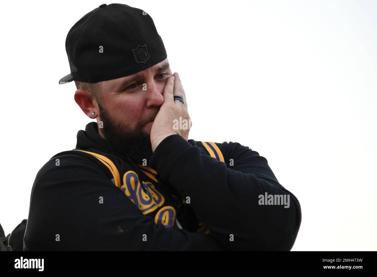 Anthony Hauk stands near the scene of a helicopter crash that killed