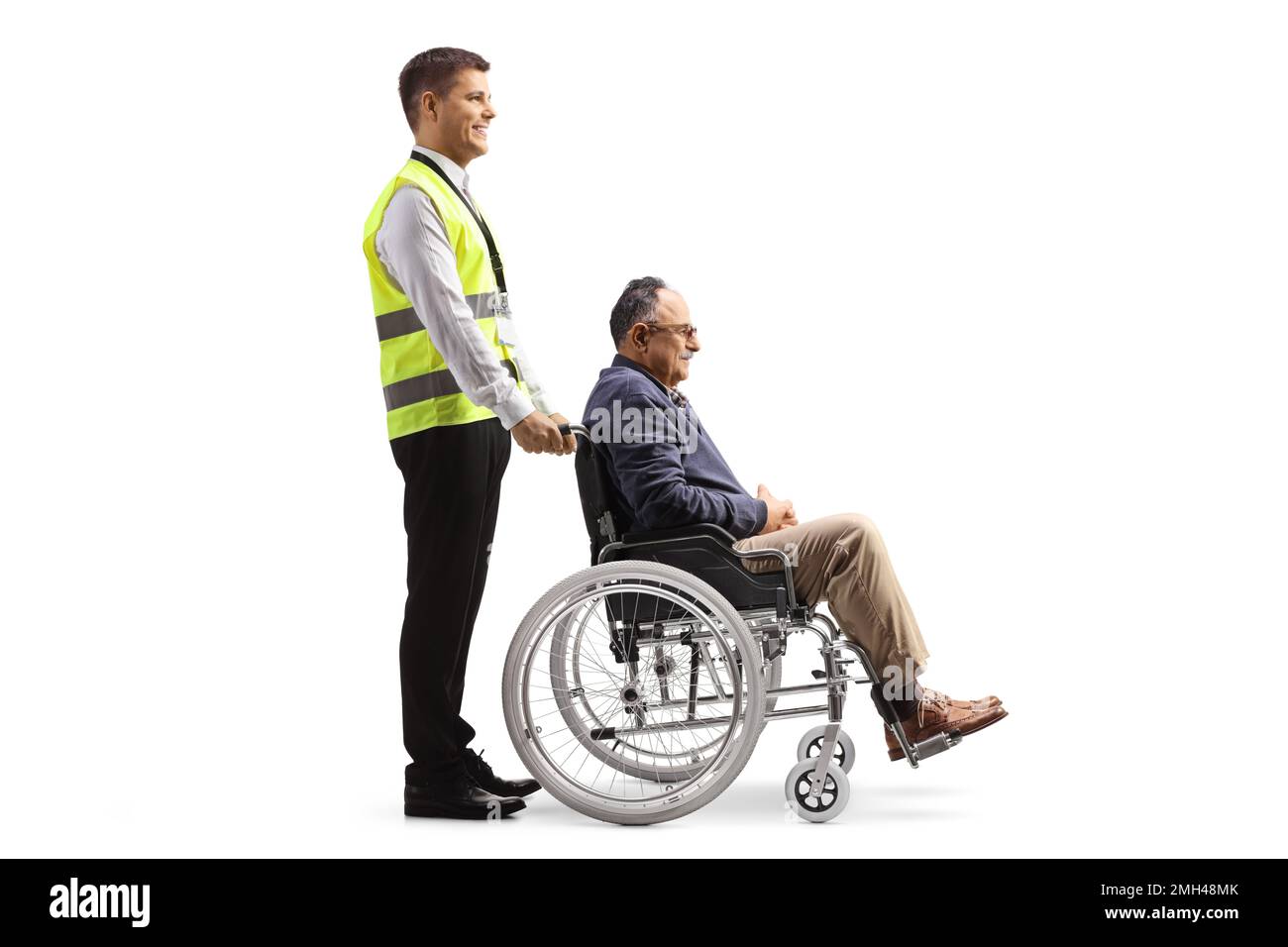 Full length profile shot of a special assitance worker with a passenger ...