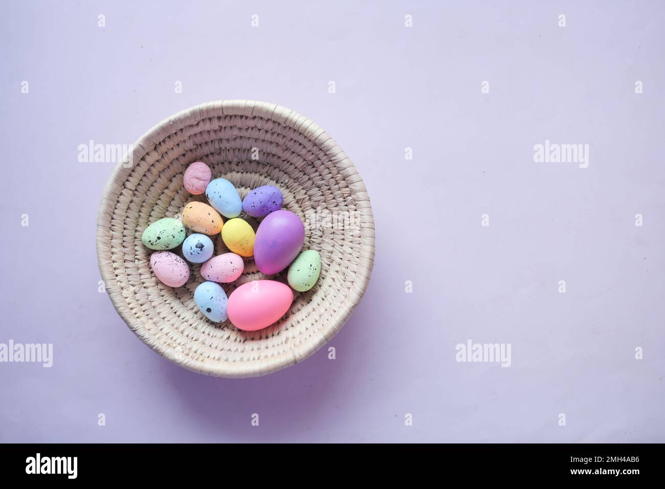 easter concept with multi color egg on pink background. Stock Photo