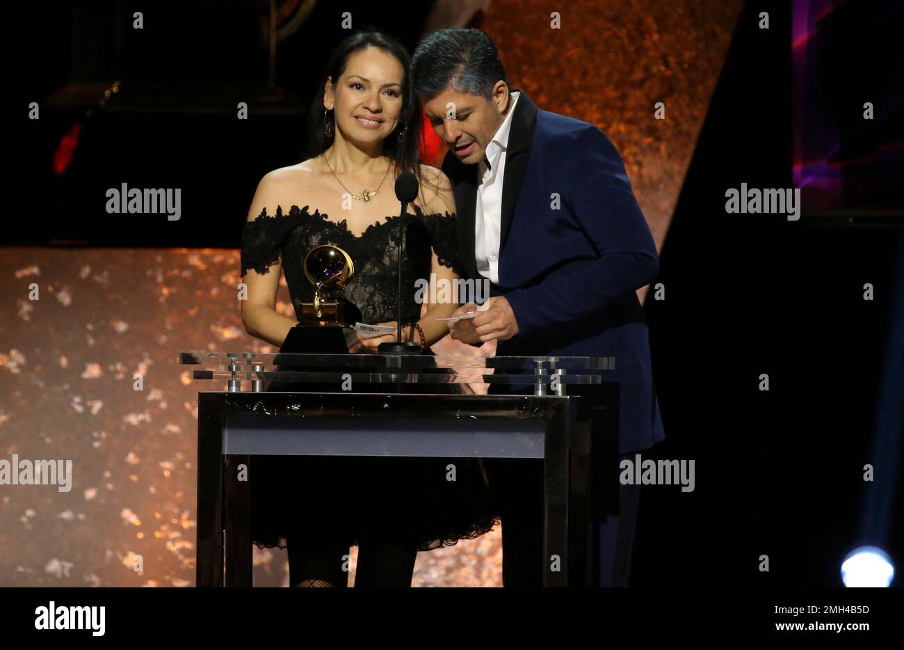 Gabriela Quintero, left, and Rodrigo Sanchez of Rodrigo y Gabriela accept the award for best