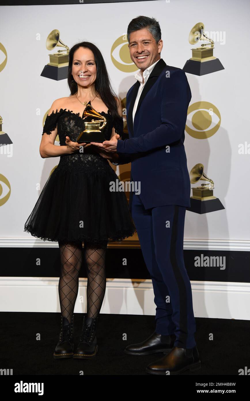 Gabriela Quintero, left, and Rodrigo Sanchez of Rodrigo y Gabriela pose
