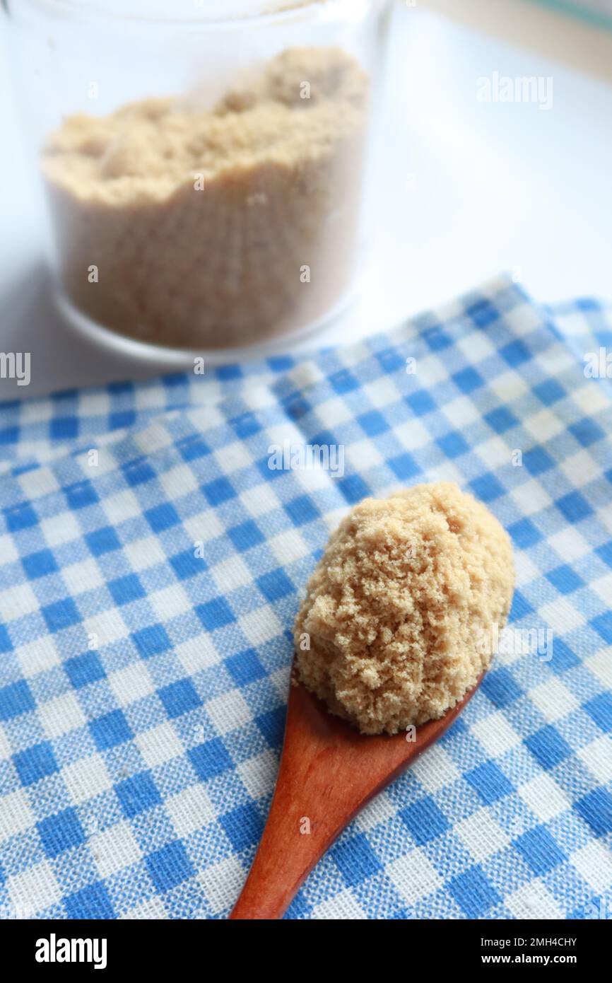 coconut sugar in a white bowl on table  Stock Photo