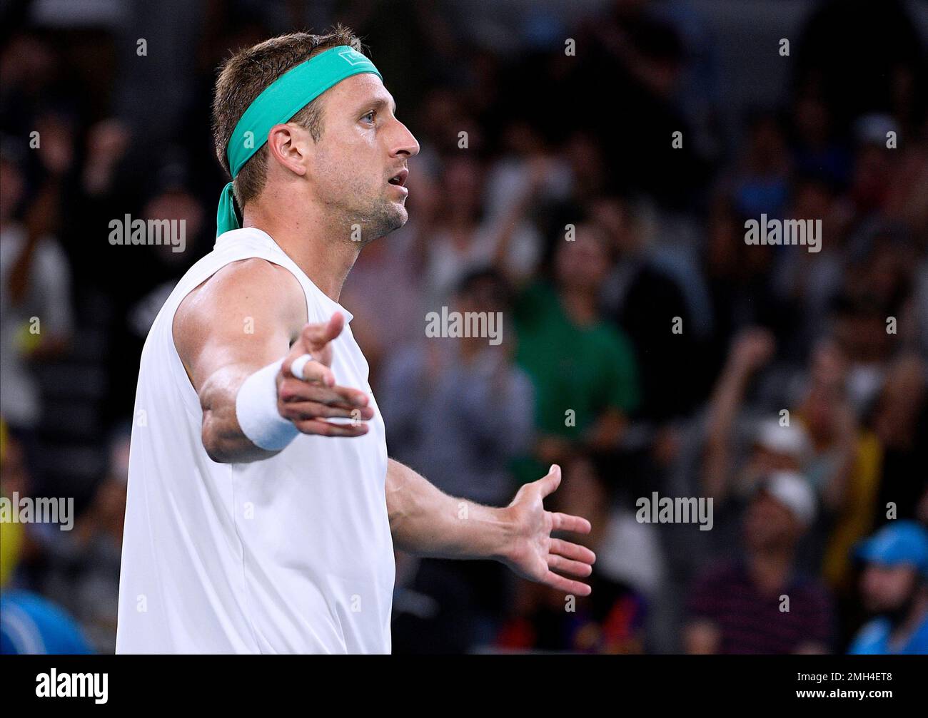Tennys Sandgren of the U.S. reacts after defeating Italy's Fabio Fognini  during their fourth round singles match at the Australian Open tennis  championship in Melbourne, Australia, Sunday, Jan. 26, 2020. (AP Photo/Andy