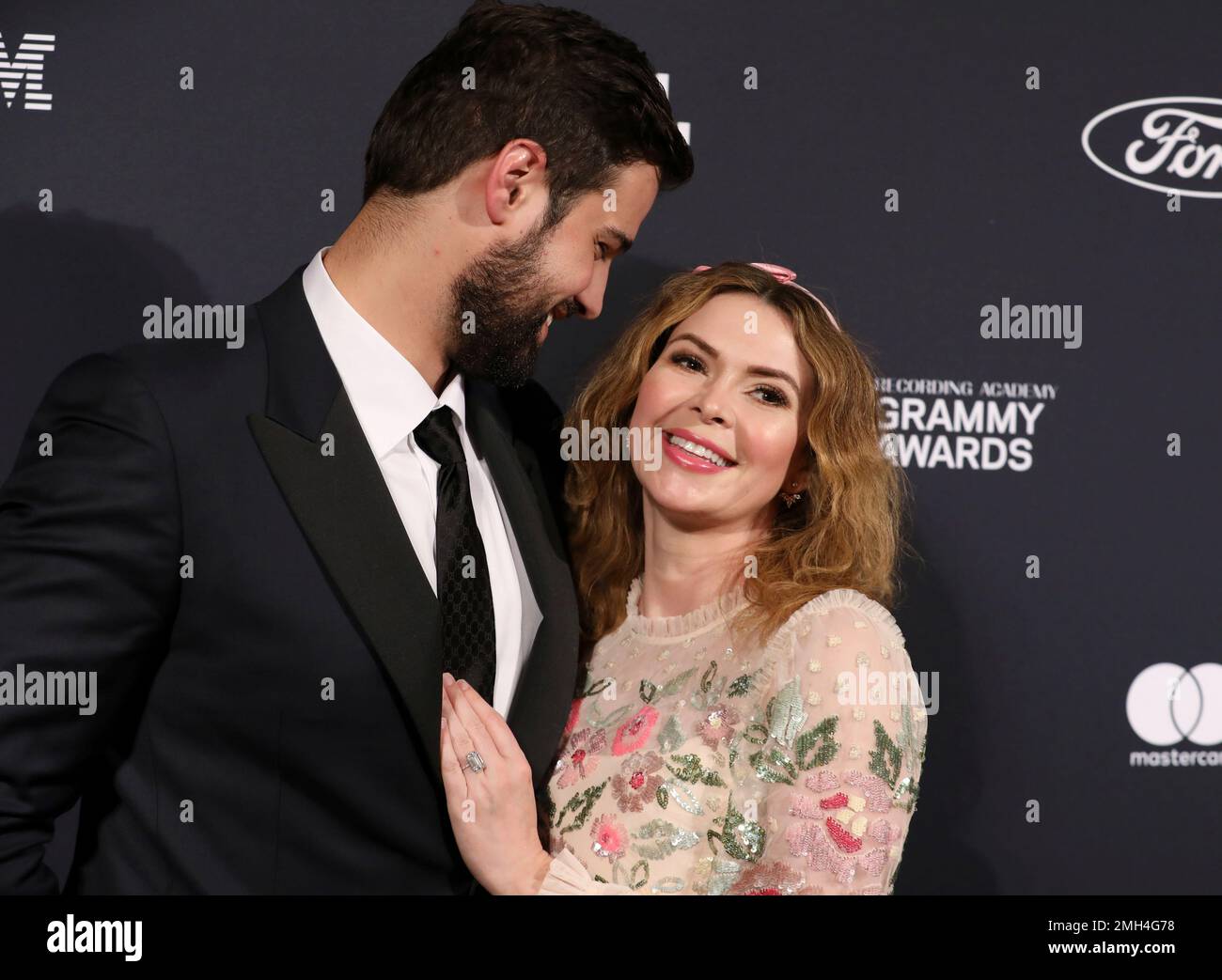 Jacob Andreou, left, and Carly Steel arrive at the Pre-Grammy Gala And ...
