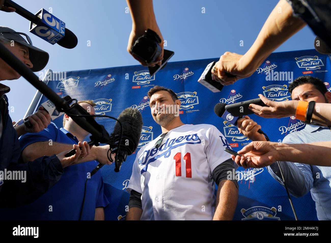 Los Angeles Dodgers' A.J. Pollock is interviewed by reporters during
