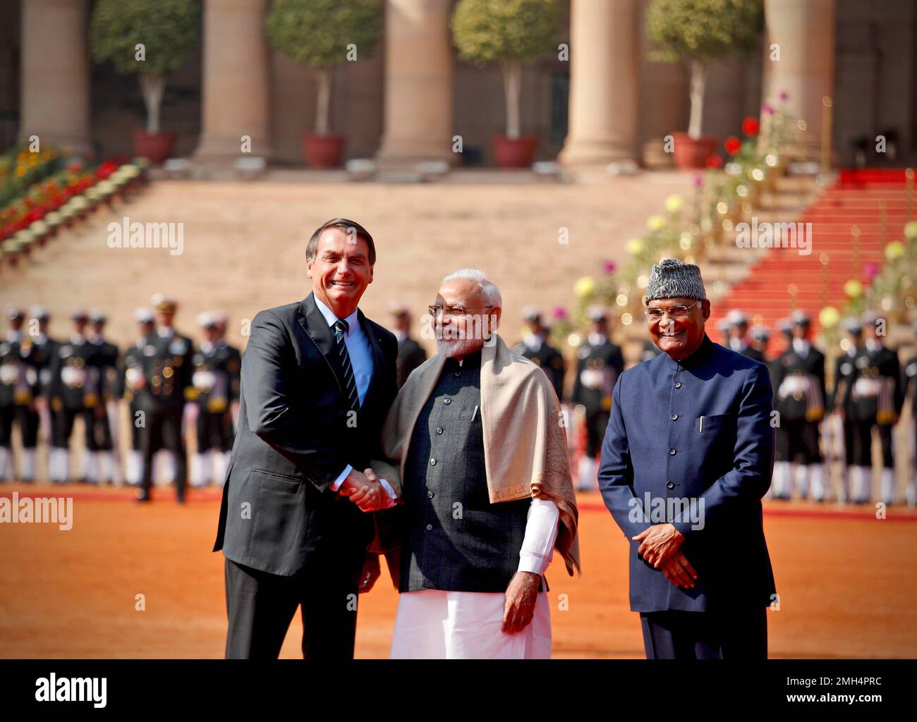 Brazil's President Jair Bolsonaro, left, shakes hand with Indian Prime ...