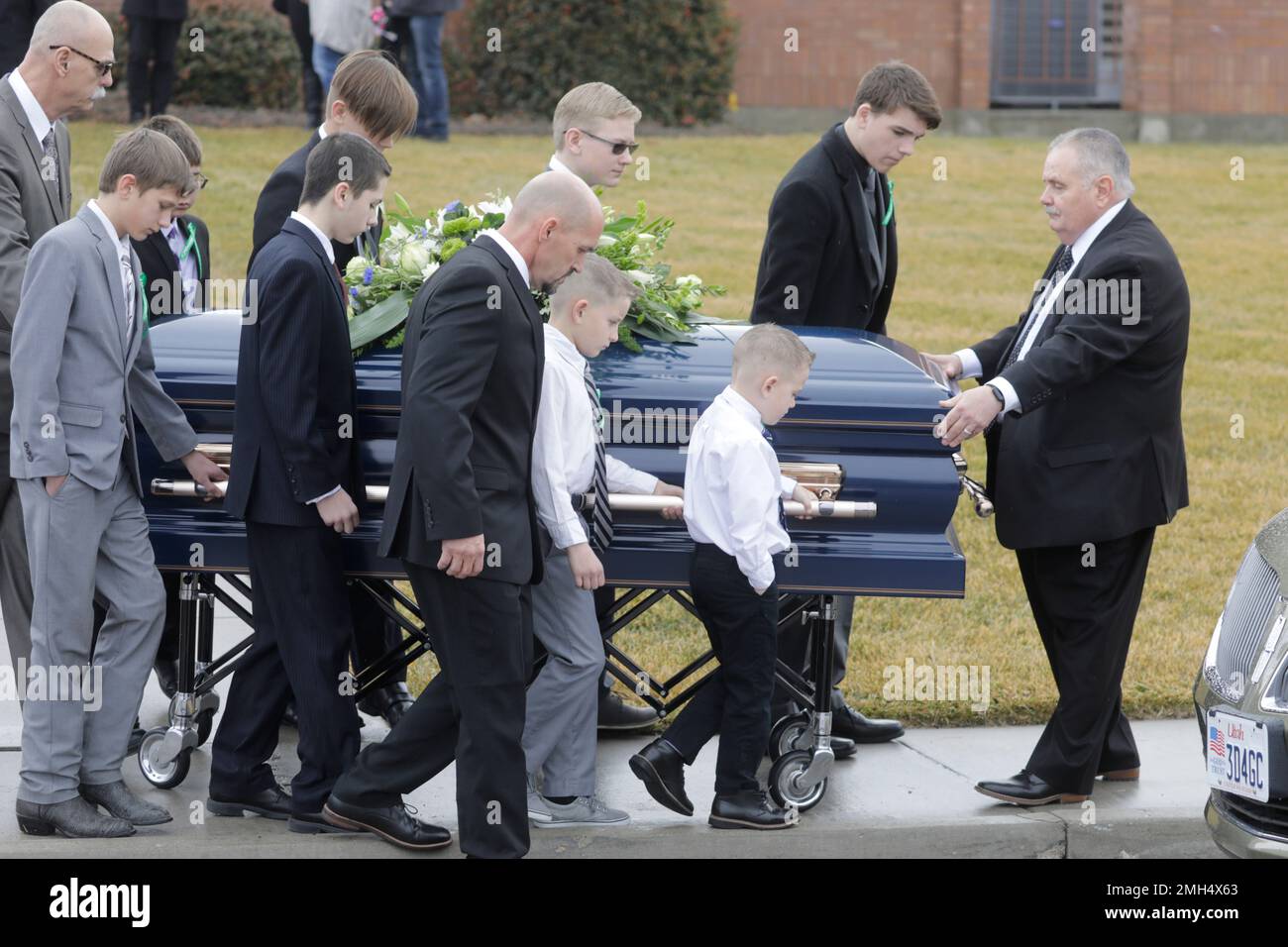 Pallbearers carry a casket following the funeral services for Consuelo
