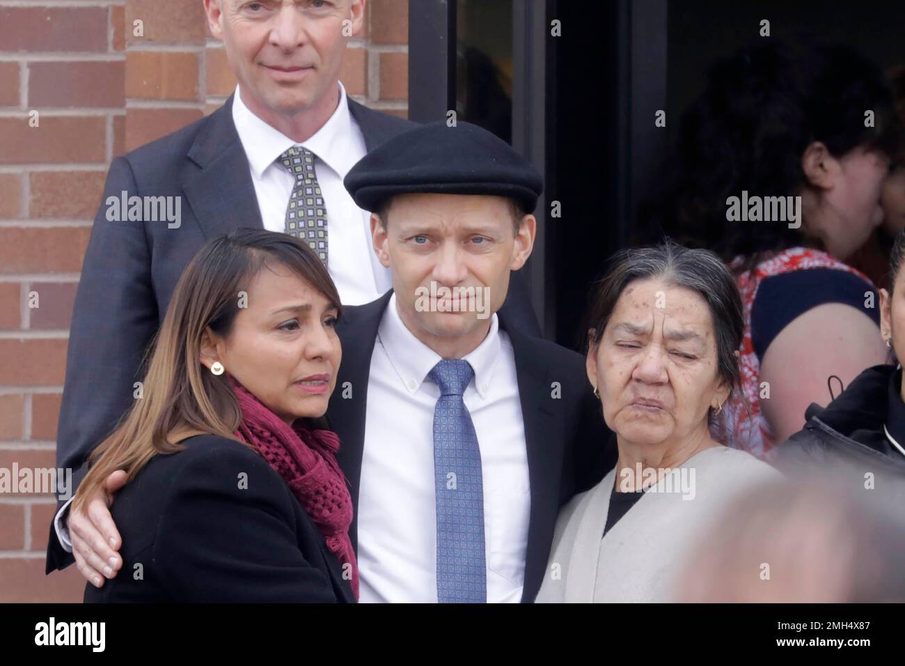 Colin Haynie, center, following the funeral for his wife Consuelo