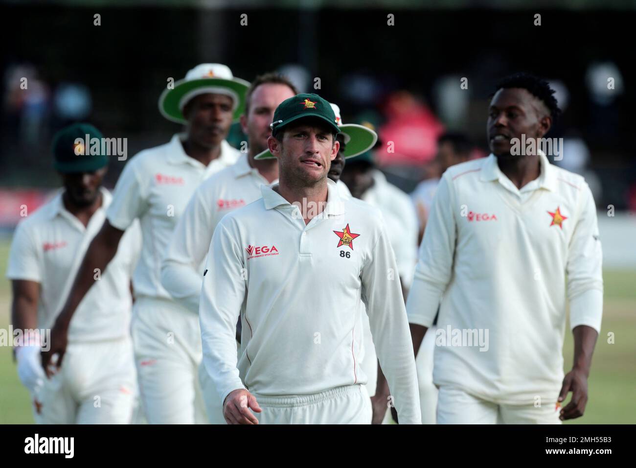 Zimbabwean players walk off the pitch after their test cricket match