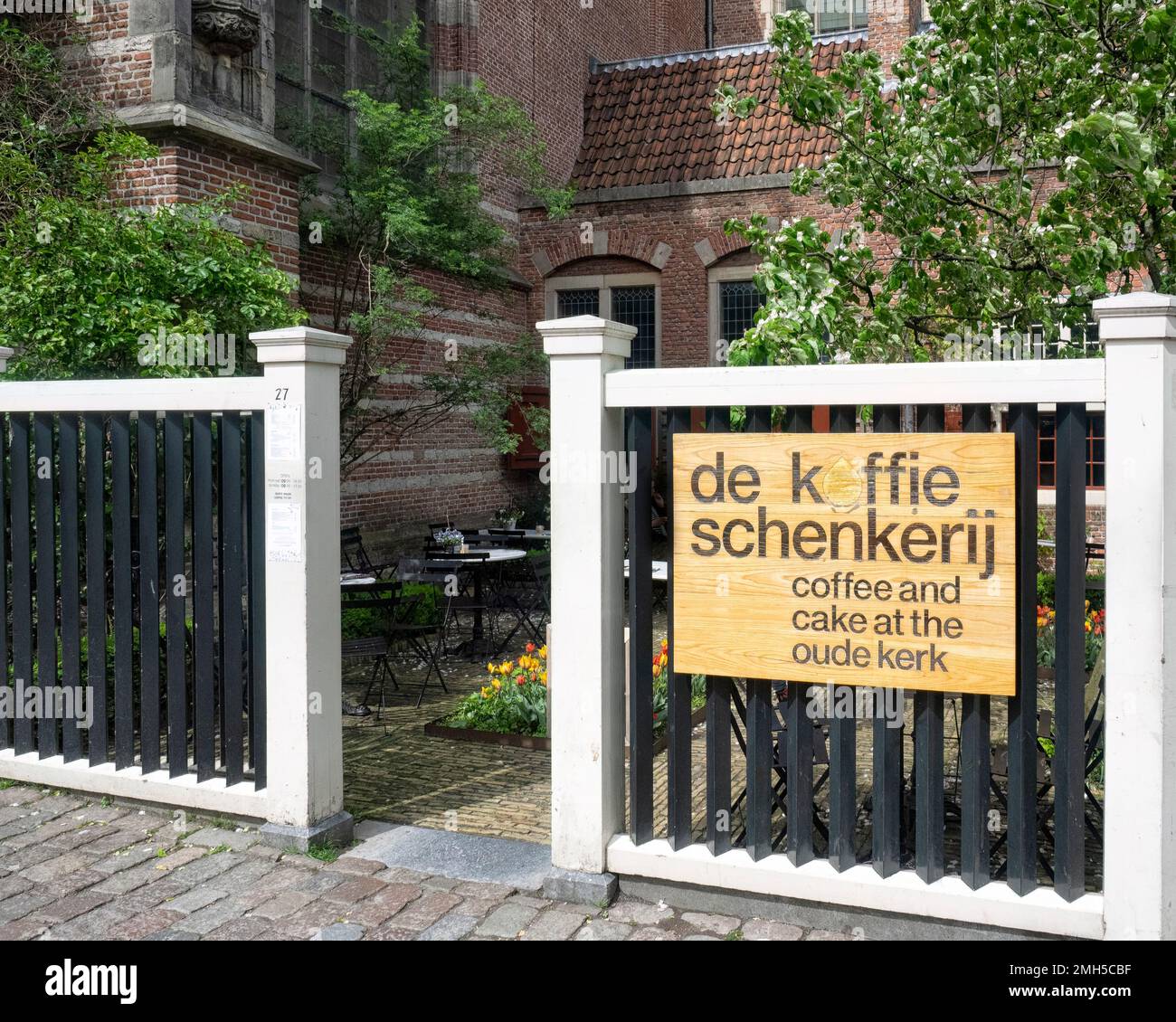 AMSTERDAM, NETHERLANDS - MAY 01, 2018:  Sign outside De Koffie schenkerij (Coffee and Cake) Cafe in the old sacristy of the Oude Kerk church Stock Photo