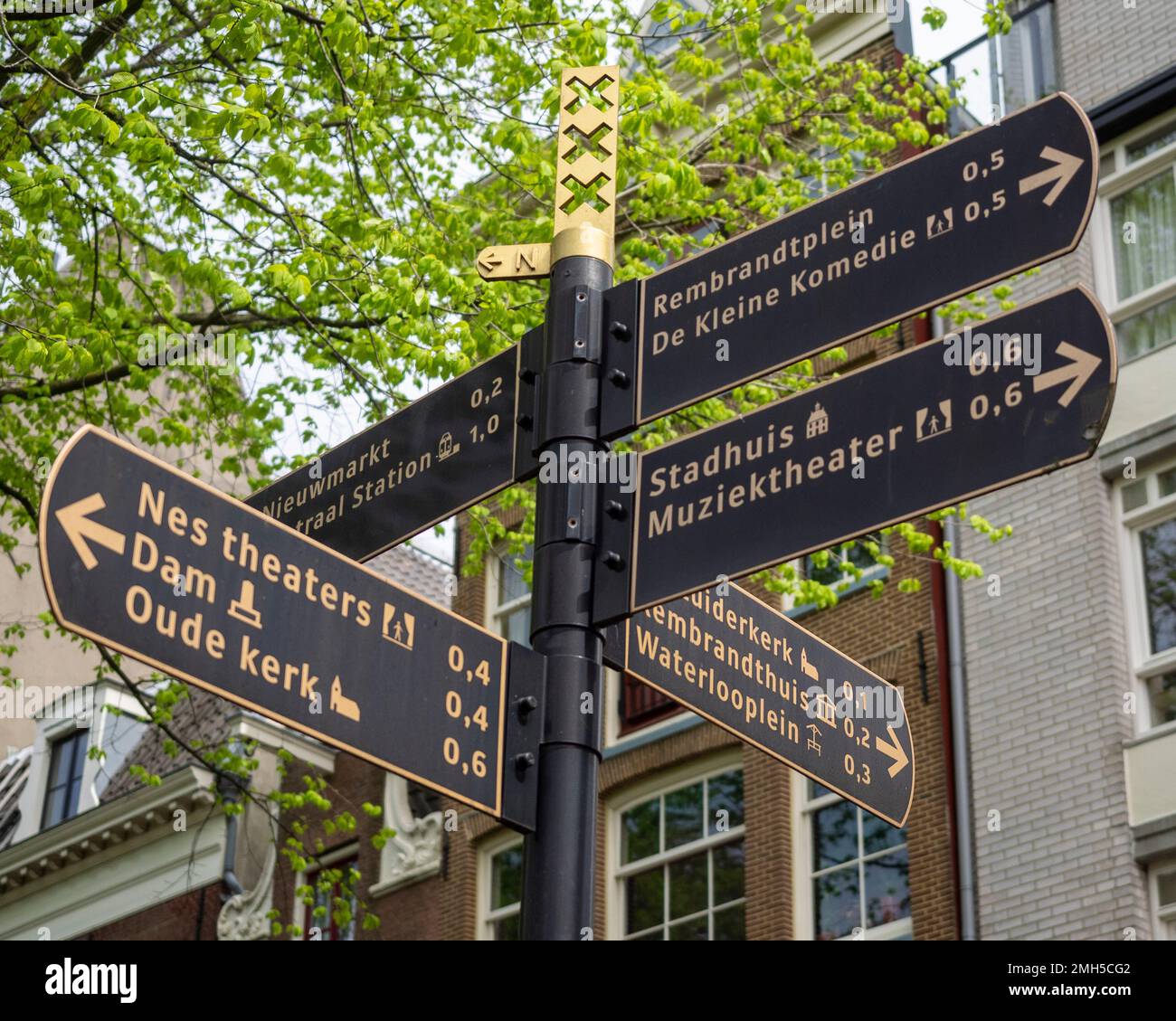 AMSTERDAM, NETHERLANDS - MAY 01, 2018:  Signpost in Central Amsterdam with directions to Oude Kerk and Stadhuis Stock Photo