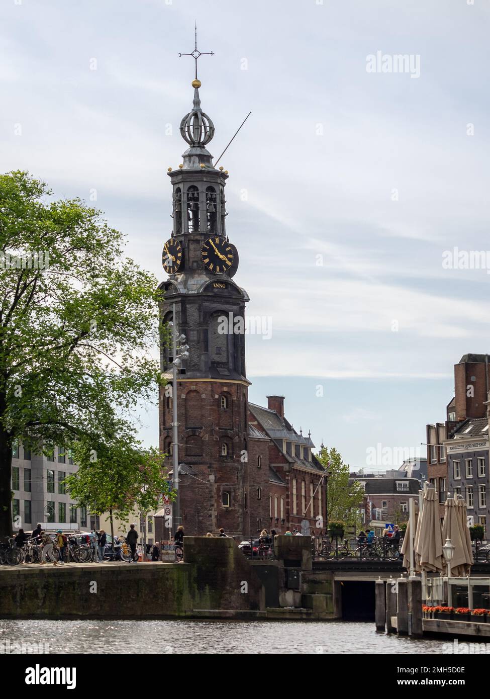 AMSTERDAM, NETHERLANDS - MAY MAY 01, 2018:  Exterior view of the Montelbaanstoren, a remnant of Amsterdams, medieval city walls Oude Schans waterway Stock Photo