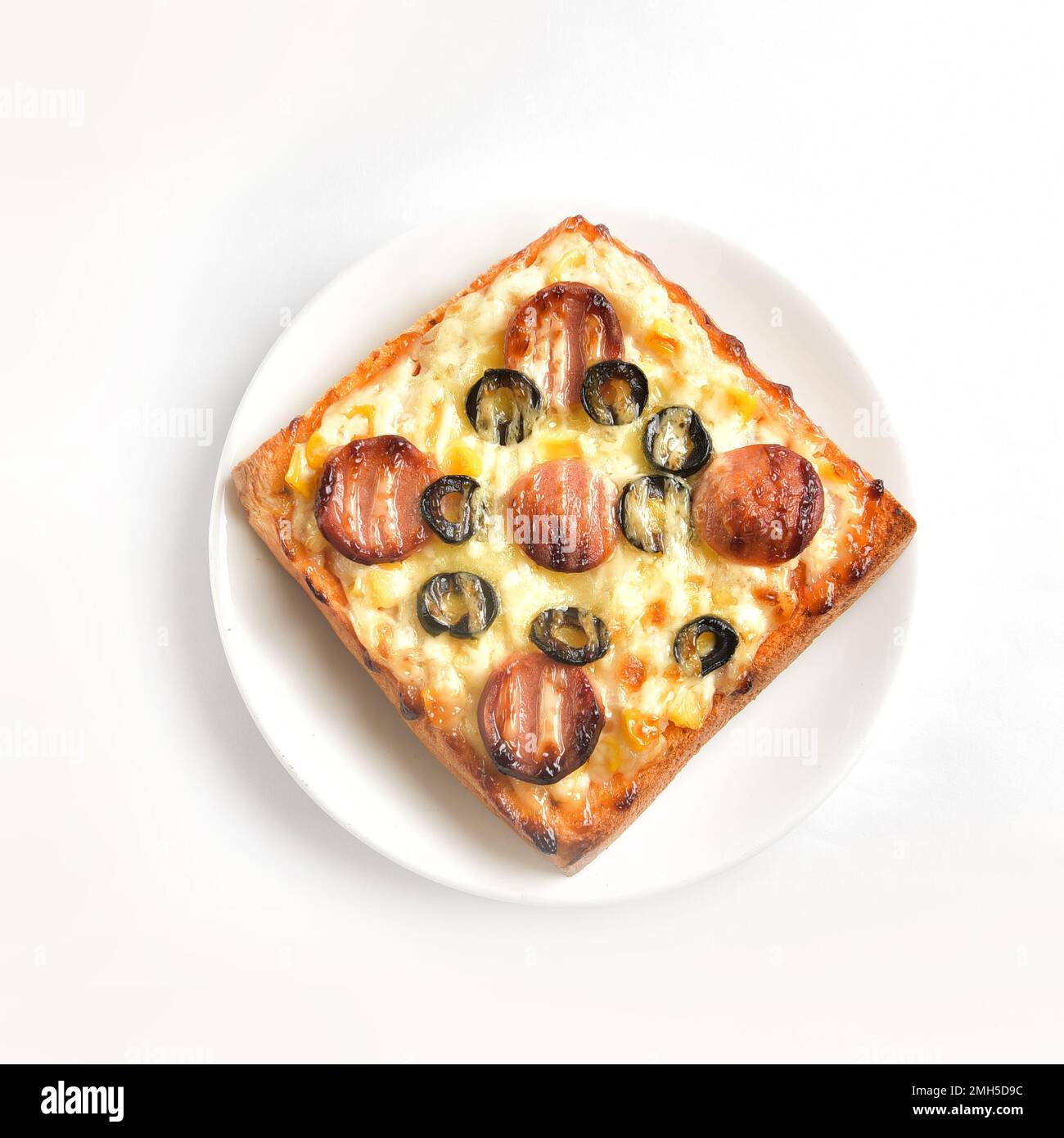 Assimilation of a sandwich as mini pizza. There are photo and vector versions for design idea. The sandwich is added with cheese, hams, pickled olive Stock Photo