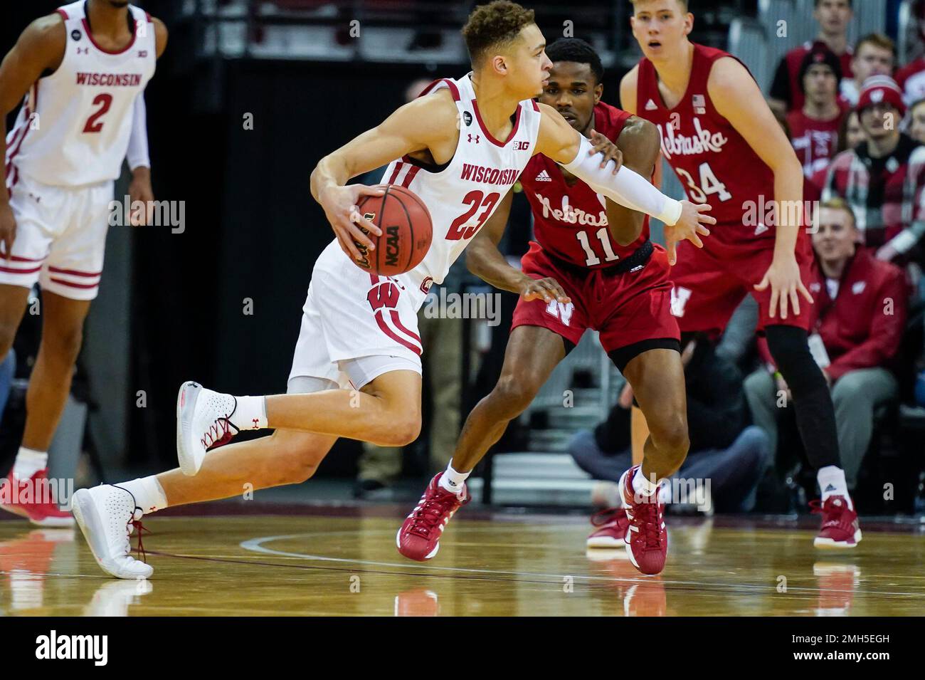 Wisconsin's Kobe King (23) drives against Nebraska's Dachon Burke Jr