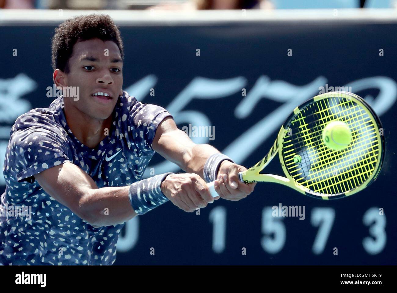 Canada's Felix Auger-Aliassime makes a forehand return to Latvia's Ernests  Gulbis during their first round singles match at the Australian Open tennis  championship in Melbourne, Australia, Tuesday, Jan. 21, 2020. (AP Photo/Dita