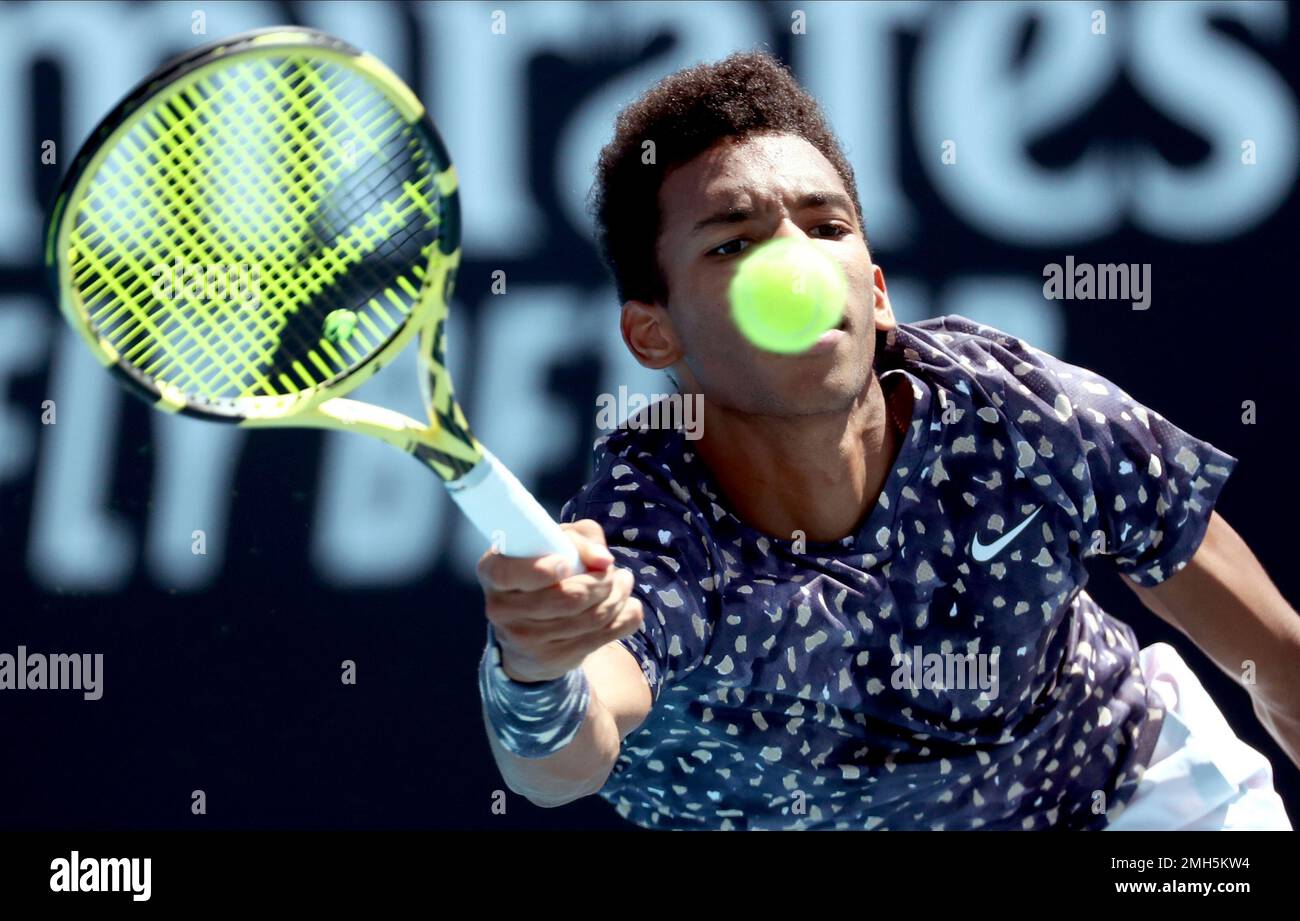 Canada's Felix Auger-Aliassime makes a forehand return to Latvia's Ernests  Gulbis during their first round singles match at the Australian Open tennis  championship in Melbourne, Australia, Tuesday, Jan. 21, 2020. (AP Photo/Dita
